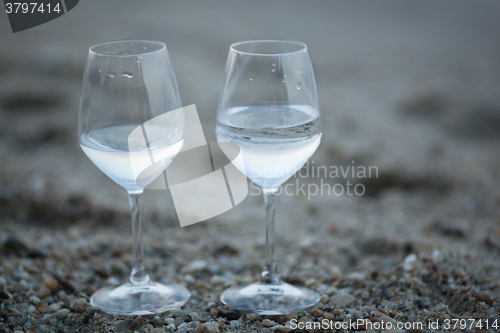 Image of Two glasses of water on the beach