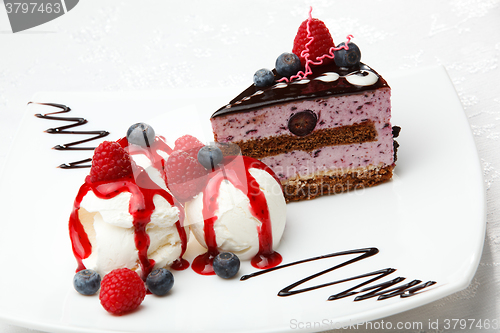 Image of Vanilla ice cream with berries and cake