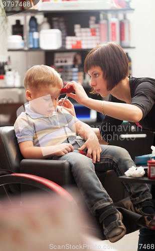 Image of Little boy at the hairdresser