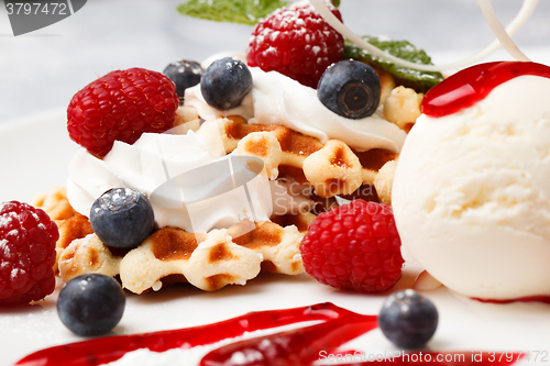 Image of Waffle with cream, ice cream and fresh berries