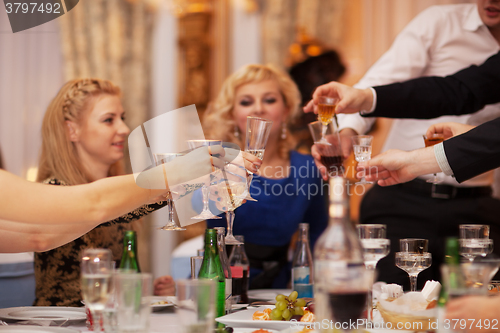 Image of Friends raising their glasses in a toast