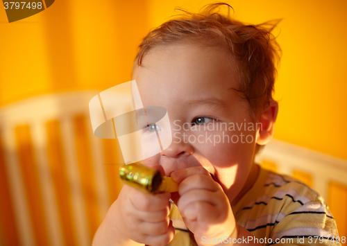 Image of Portrait of the boy playing in playpen.