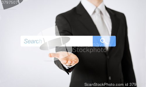 Image of close up of man showing internet search bar
