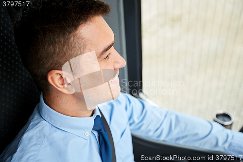 Image of close up of happy bus driver or businessman