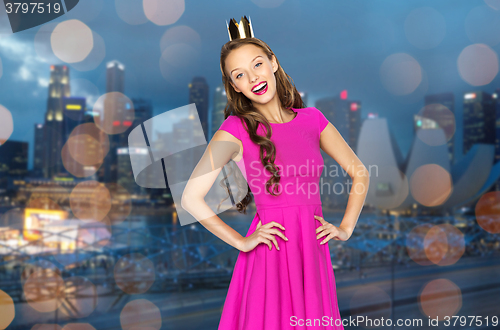 Image of happy young woman or teen girl in pink dress