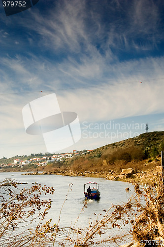 Image of The small boat on the river