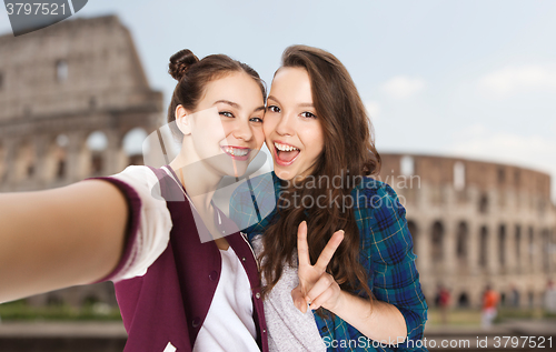 Image of friends taking selfie over coliseum