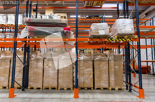 Image of cargo boxes storing at warehouse shelves