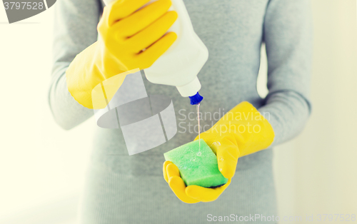 Image of close up of woman with sponge and cleanser