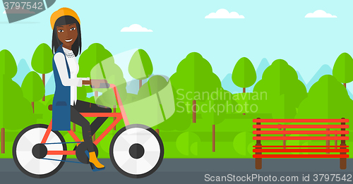 Image of Woman riding bicycle.