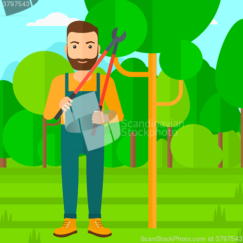 Image of Farmer with pruner in garden.