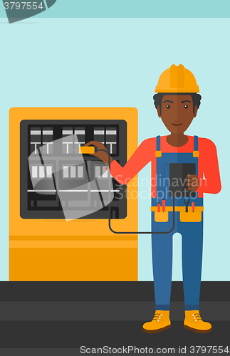 Image of Electrician with electrical equipment.