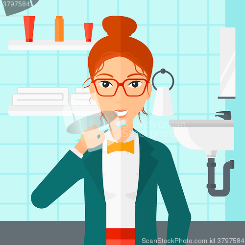 Image of Woman brushing teeth.