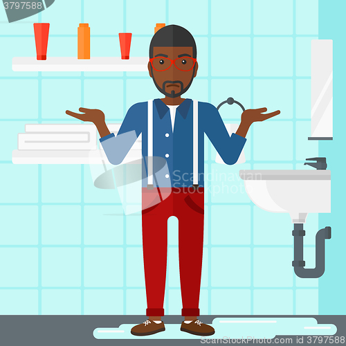 Image of Man in despair standing near leaking sink.