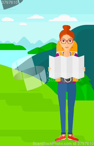 Image of Backpacker looking at map.