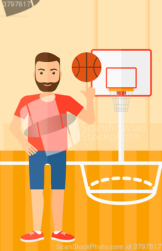 Image of Basketball player spinning ball.