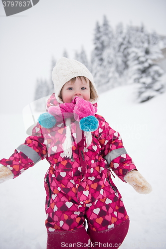 Image of little girl at snowy winter day