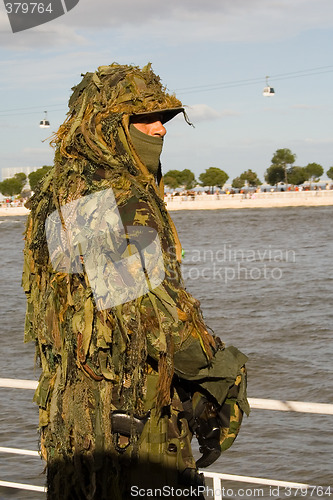 Image of Military camouflaged solder.