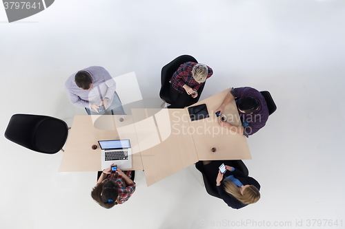Image of aerial view of business people group on meeting