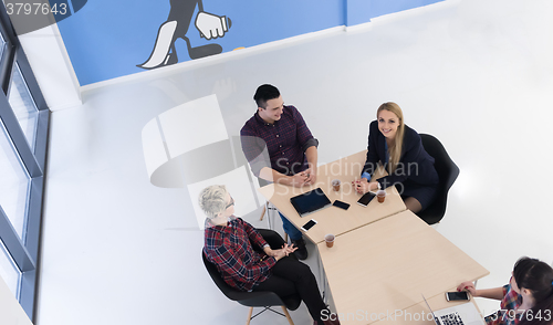 Image of aerial view of business people group on meeting