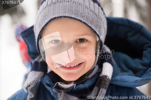 Image of little boy having fun on winter day