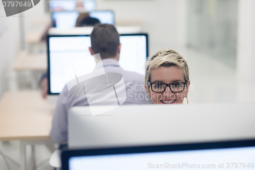 Image of startup business, woman  working on desktop computer