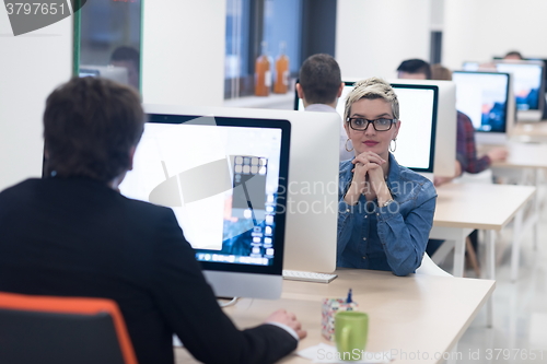 Image of startup business, woman  working on desktop computer