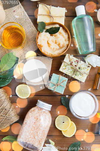 Image of close up of body care cosmetic products on wood