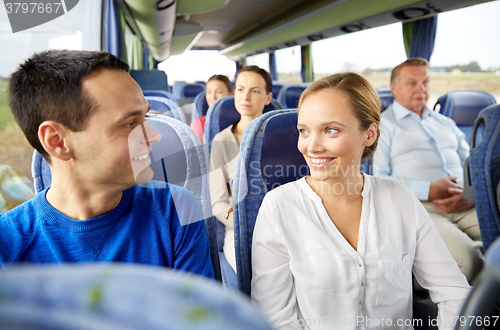 Image of group of happy passengers in travel bus