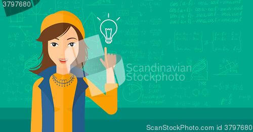 Image of Woman pointing at light bulb.