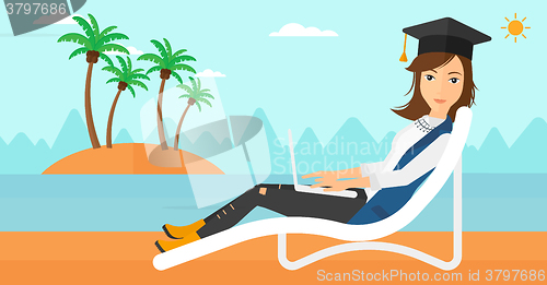 Image of Graduate lying on chaise lounge with laptop.