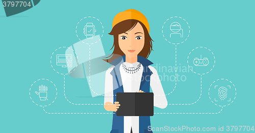 Image of Woman holding tablet computer.