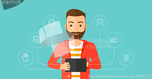 Image of Man holding tablet computer.