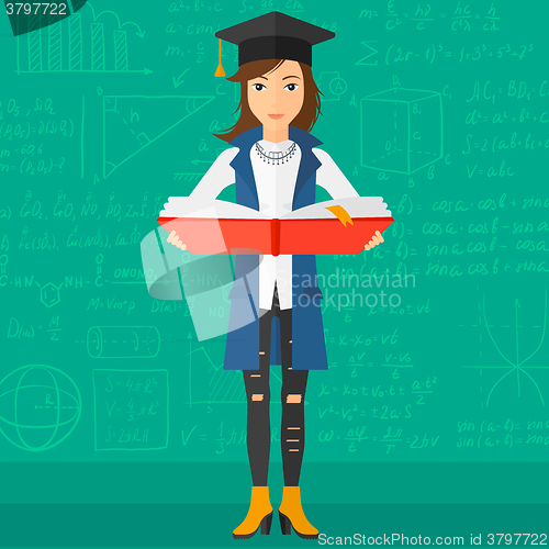 Image of Woman in graduation cap holding book.