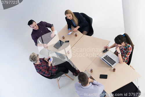 Image of aerial view of business people group on meeting