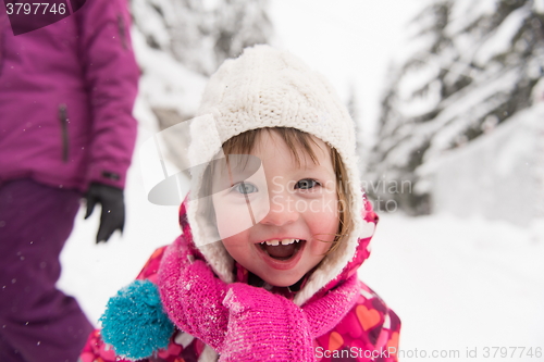 Image of little girl at snowy winter day
