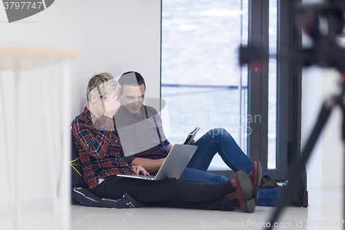 Image of startup business, couple working on laptop computer at office