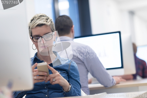 Image of startup business, woman  working on desktop computer