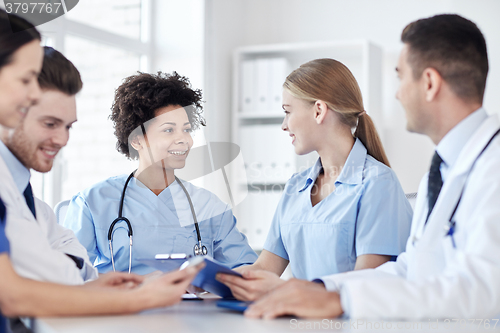 Image of group of happy doctors meeting at hospital office