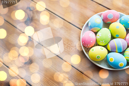 Image of close up of colored easter eggs on plate