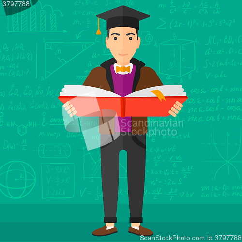 Image of Man in graduation cap holding book.