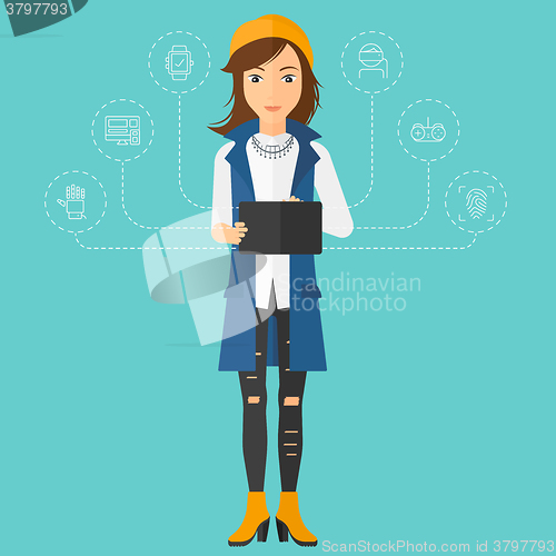 Image of Woman holding tablet computer.
