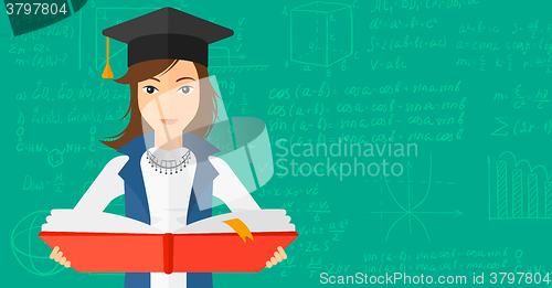 Image of Woman in graduation cap holding book.