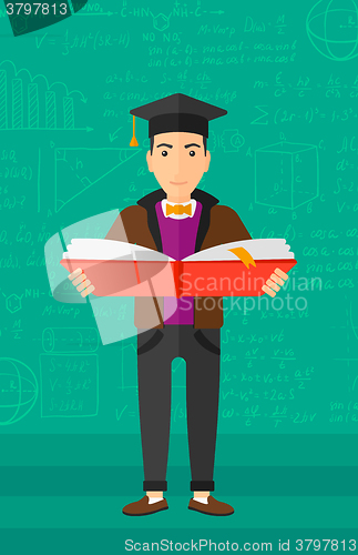 Image of Man in graduation cap holding book.