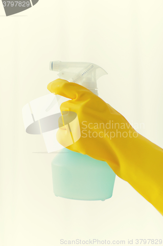 Image of close up of hand with cleanser spraying