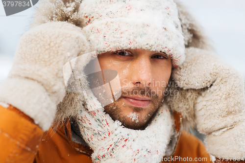 Image of face of man in winter clothes outdoors