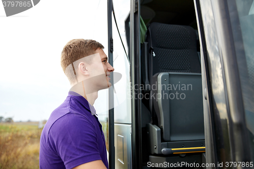 Image of group of happy male passenger boarding travel bus