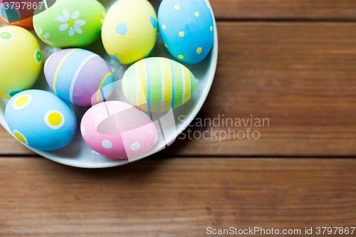 Image of close up of colored easter eggs on plate