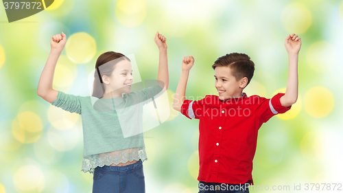 Image of happy boy and girl celebrating victory