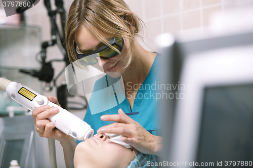 Image of Woman having a laser skin treatment